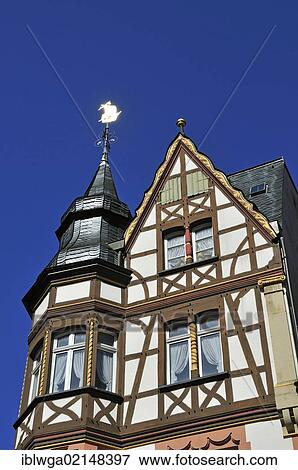 Stock Photo - Half-timbered house with a weather vane on the marketplace of Bernkastel-Kues, Rhineland-Palatinate, Germany, Europe, PublicGround, Europe. Fotosearch