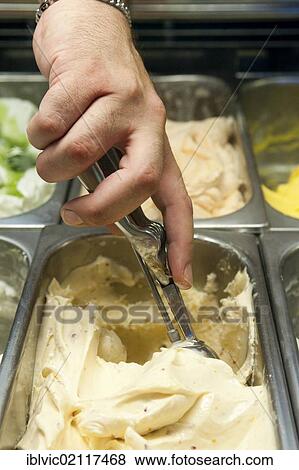 Hand of an ice-cream seller, scooping ice cream, scoop, ice cream parlour, Rome, Italy, Europe View Large Photo Image Stock Photo - Hand of an ice-cream seller, scooping ice cream, scoop, ice cream parlour, Rome, Italy, Europe. Fotosearch