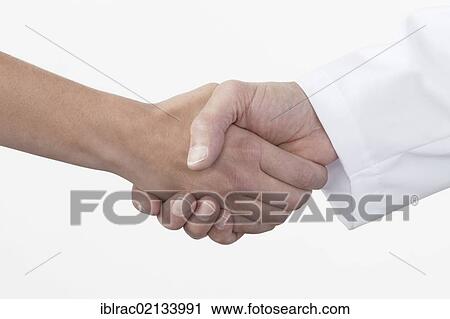 Hands shaking, handshake between patient and doctor View Large Photo Image Stock Image - Hands shaking, handshake between patient and doctor. Fotosearch