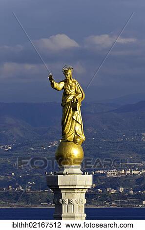 Stock Image - Harbour entrance of Messina with the statue of the Madonna della Lettera on Campana Tower, Italy, Europe. Fotosearch