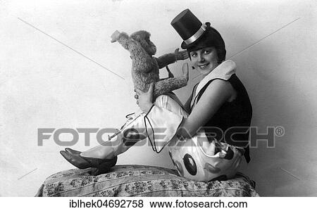 Harlequin woman with toy monkey, 1930s, Germany, Europe View Large Photo Image Stock Photo - Harlequin woman with toy monkey, 1930s, Germany, Europe. Fotosearch