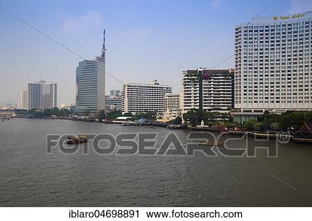 Stock Image - High-rise buildings on Chao Praya River, Bangkok, Thailand, Asia. Fotosearch