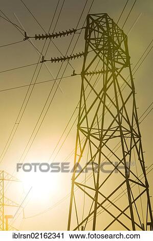 Stock Image - High voltage electricity pylon in the evening sun, American Canyon, California, USA, North America. Fotosearch