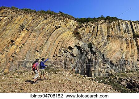 Hikers in front of Hexagonal Rock Columns in Geo Park, Sai Kung Peninsula, New Territories, Hong Kong, China, Asia View Large Photo Image Stock Image - Hikers in front of Hexagonal Rock Columns in Geo Park, Sai Kung Peninsula, New Territories, Hong Kong, China, Asia. Fotosearch
