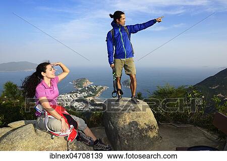 Hikers look out, Dragons Back Trail, view on Shek O Bay, Hong Kong, China, Asia View Large Photo Image Stock Photo - Hikers look out, Dragons Back Trail, view on Shek O Bay, Hong Kong, China, Asia. Fotosearch