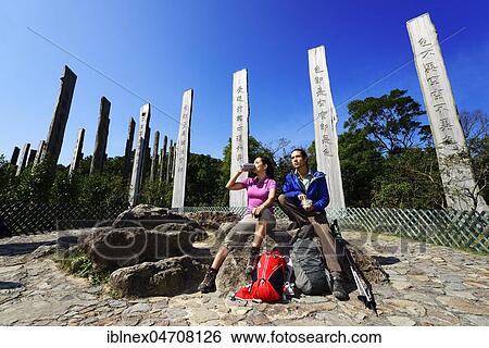 Hikers rest in front of wooden steles at Wisdom Path, Lantau Island, Hong Kong, China, Asia View Large Photo Image Stock Photograph - Hikers rest in front of wooden steles at Wisdom Path, Lantau Island, Hong Kong, China, Asia. Fotosearch
