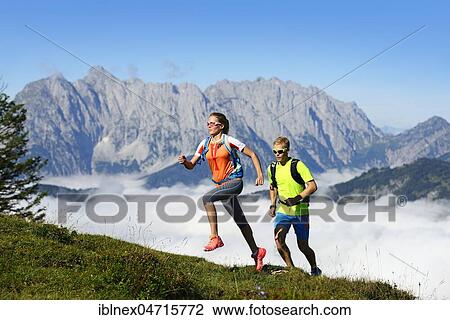 Hikers, Trail running on the Eggenalm, trail running on the Eggenalm, behind Wilder Kaiser mountain range, Reit im Winkl, Upper Bavaria, Bavaria, Germany, Europe View Large Photo Image Stock Image - Hikers, Trail running on the Eggenalm, trail running on the Eggenalm, behind Wilder Kaiser mountain range, Reit im Winkl, Upper Bavaria, Bavaria, Germany, Europe. Fotosearch