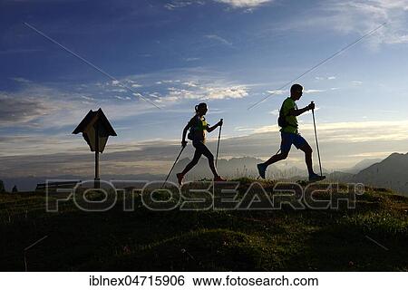 Hikers, Trail running on the Eggenalm, back light, behind Wilder Kaiser mountain range, Reit im Winkl, Upper Bavaria, Bavaria, Germany, Europe View Large Photo Image Stock Photograph - Hikers, Trail running on the Eggenalm, back light, behind Wilder Kaiser mountain range, Reit im Winkl, Upper Bavaria, Bavaria, Germany, Europe. Fotosearch