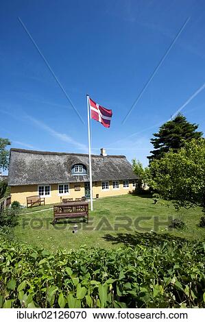 House and Danish flag in Sonderho, Fano island, Denmark, Scandinavia, Europe View Large Photo Image Stock Image - House and Danish flag in Sonderho, Fano island, Denmark, Scandinavia, Europe. Fotosearch