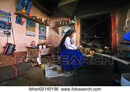 Housewife at the hearth in her kitchen, wearing the traditionell clothes of the Amantani-Quechua, Isla Amantani in Lake Titicaca, Amantani, Peru, South America View Large Photo Image Stock Photograph - Housewife at the hearth in her kitchen, wearing the traditionell clothes of the Amantani-Quechua, Isla Amantani in Lake Titicaca, Amantani, Peru, South America. Fotosearch