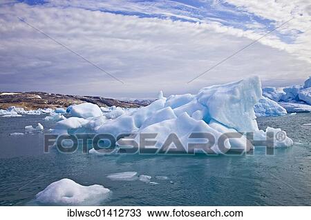 Stock Image - Iceberg in the Sermilik fjord, Ammassalik district, East Greenland, Greenland, Denmark, North America. Fotosearch