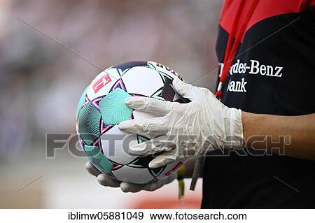 Implementation DFL hygiene concept, ball boy holds ball with protective gloves, Mercedes-Benz Arena, Corona crisis, Stuttgart, Baden-Württemberg, Germany, Europe View Large Photo Image Stock Photo - Implementation DFL hygiene concept, ball boy holds ball with protective gloves, Mercedes-Benz Arena, Corona crisis, Stuttgart, Baden-Württemberg, Germany, Europe. Fotosearch