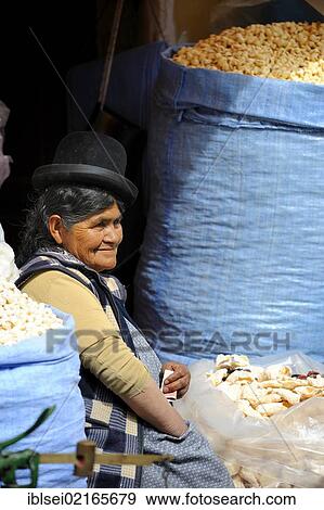 Stock Photo - Indian woman with a stall by the side of the road, La Paz, Bolivia, South America. Fotosearch