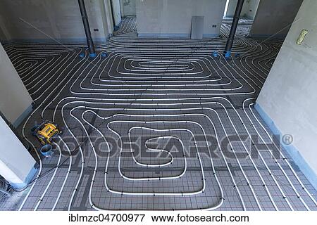 Stock Photo - Installed underfloor heating in a new apartment, Mecklenburg-Western Pomerania, Germany, Europe. Fotosearch