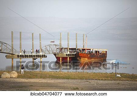 Jetty with boats for tourists on Lake Tiberias, Kinneret, Galilee, Israel, Asia View Large Photo Image Stock Photo - Jetty with boats for tourists on Lake Tiberias, Kinneret, Galilee, Israel, Asia. Fotosearch