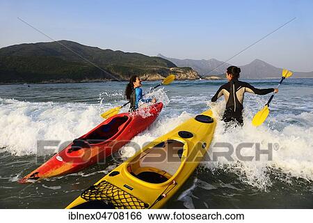 Stock Photograph - Kayakers at Sai Wan Beach, Big Wave Bay, also Tai Long Wan, Sai Kung Peninsula, New Territories, Hong Kong, China, Asia. Fotosearch