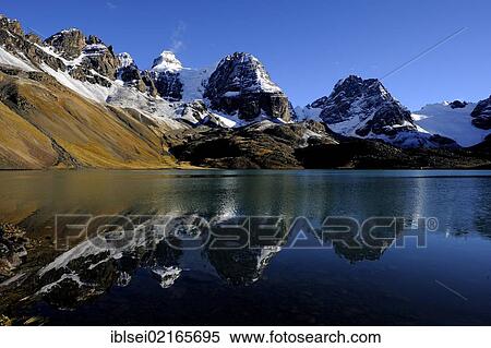 Stock Photography - Lagoon with a reflection of the Andes Mountains, Tuni, La Paz, Bolivia, South America. Fotosearch