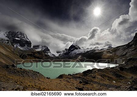 Lagoon with the Andes Mountains and dramatic clouds, Tuni, La Paz, Bolivia, South America View Large Photo Image Stock Image - Lagoon with the Andes Mountains and dramatic clouds, Tuni, La Paz, Bolivia, South America. Fotosearch