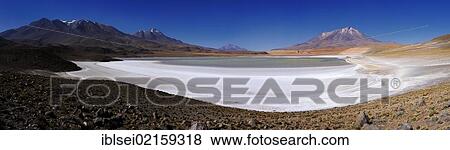Stock Photo - Laguna Blanka lagoon in front of a panoramic view of the Andes Mountains, Uyuni, Bolivia, South America. Fotosearch