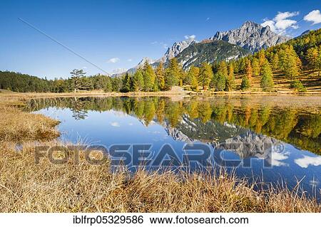 Stock Photograph - Lai Nair with Piz Lischana, 3105m and Piz San Jon Dadora, 3048m, Graubuenden, Switzerland, Europe. Fotosearch