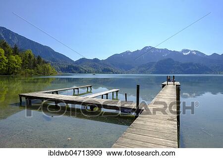 Lake Kochelsee, with a view on the Herzogstand and Heimgarten, Upper Bavaria, Bavaria, Germany, Europe View Large Photo Image Stock Photo - Lake Kochelsee, with a view on the Herzogstand and Heimgarten, Upper Bavaria, Bavaria, Germany, Europe. Fotosearch