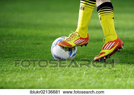 Legs and Adidas shoes of a Dortmund player with the league ball, preparatory match for the second round of the tournament season 2011-2012, Fortuna Dusseldorf - Borussia Dortmund, Stadtwerke Duesseldorf Wintercup in the ESPRIT Arena, Dusseldorf, North... View Large Photo Image Stock Image - Legs and Adidas shoes of a Dortmund player with the league ball, preparatory match for the second round of the tournament season 2011-2012, Fortuna Dusseldorf - Borussia Dortmund, Stadtwerke Duesseldorf Wintercup in the ESPRIT Arena, Dusseldorf, North.... Fotosearch
