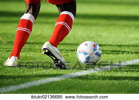 Legs and Nike shoes of a Duesseldorf player with the league ball, preparatory match for the second round of the tournament season 2011-2012, Fortuna Duesseldorf - Borussia Dortmund, Stadtwerke Duesseldorf Wintercup in the ESPRIT Arena, Dusseldorf,... View Large Photo Image Stock Photography - Legs and Nike shoes of a Duesseldorf player with the league ball, preparatory match for the second round of the tournament season 2011-2012, Fortuna Duesseldorf - Borussia Dortmund, Stadtwerke Duesseldorf Wintercup in the ESPRIT Arena, Dusseldorf,.... Fotosearch