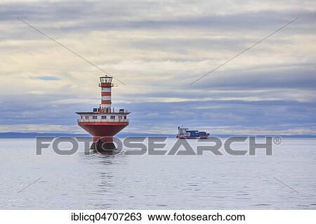 Lighthouse Phare du Haut-Fond Prince in Saint Lawrence River with freighter in the back, Tadoussac, Québec Province, Canada, North America View Large Photo Image Stock Image - Lighthouse Phare du Haut-Fond Prince in Saint Lawrence River with freighter in the back, Tadoussac, Québec Province, Canada, North America. Fotosearch