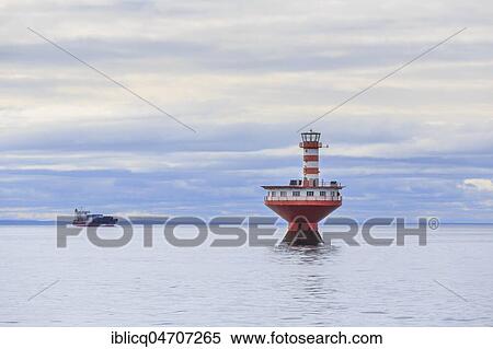 Lighthouse Phare du Haut-Fond Prince in Saint Lawrence River with freighter in the back, Tadoussac, Québec Province, Canada, North America View Large Photo Image Stock Photography - Lighthouse Phare du Haut-Fond Prince in Saint Lawrence River with freighter in the back, Tadoussac, Québec Province, Canada, North America. Fotosearch