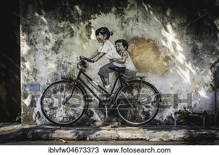 Little Children on a Bicycle, mural, Streetart, by Lithuanian artist Ernest Zacharevic, George Town Festival 2012, Armenian Street, George Town, Penang, Malaysia, Asia View Large Photo Image Stock Image - Little Children on a Bicycle, mural, Streetart, by Lithuanian artist Ernest Zacharevic, George Town Festival 2012, Armenian Street, George Town, Penang, Malaysia, Asia. Fotosearch
