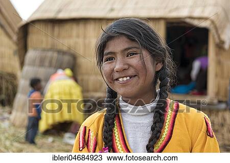 Stock Image - Local girl laughs, portrait, tribe of the Urus, Lake Titicaca, Puno region, Peru, South America. Fotosearch