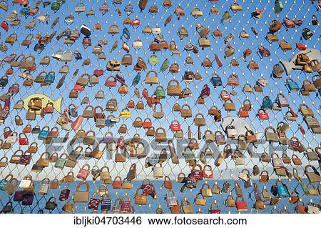 Stock Photograph - Love locks on pier, Heiligenhafen, Baltic Sea, Schleswig-Holstein, Germany, Europe. Fotosearch
