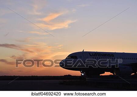Lufthansa, Airbus, A319-100, taxiing from Runway North to Terminal 2, Sunset, Munich Airport, Upper Bavaria, Bavaria, Germany, Europe View Large Photo Image Stock Image - Lufthansa, Airbus, A319-100, taxiing from Runway North to Terminal 2, Sunset, Munich Airport, Upper Bavaria, Bavaria, Germany, Europe. Fotosearch