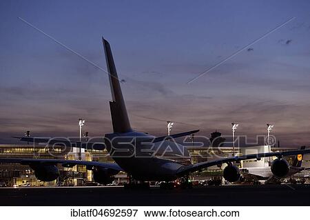 Lufthansa, Airbus, A380-800, is towed with Push Back Truck to position to Terminal 2, Twilight, Munich Airport, Upper Bavaria, Bavaria, Germany, Europe View Large Photo Image Stock Photo - Lufthansa, Airbus, A380-800, is towed with Push Back Truck to position to Terminal 2, Twilight, Munich Airport, Upper Bavaria, Bavaria, Germany, Europe. Fotosearch