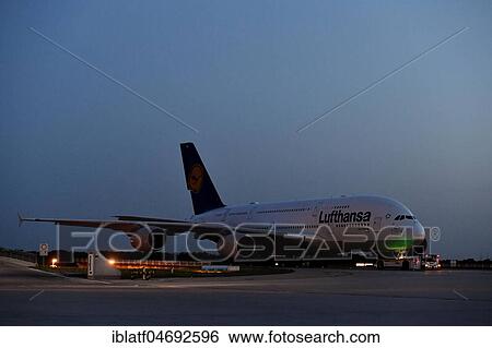 Stock Photograph - Lufthansa, Airbus, A380-800 with Push Back Truck at night, Munich Airport, Upper Bavaria, Bavaria, Germany, Europe. Fotosearch