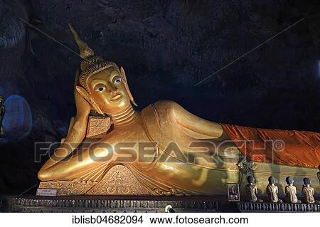 Lying golden Buddha in the cave temple Wat Tham Suwan Khuha, Phang Nga, Thailand, Asia View Large Photo Image Picture - Lying golden Buddha in the cave temple Wat Tham Suwan Khuha, Phang Nga, Thailand, Asia. Fotosearch