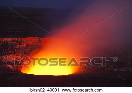 Stock Image - Magma in the Halema'uma'u Crater in the Kilauea Caldera illuminating the rising sulfur dioxide plume against the evening sky, Hawai'i Volcanoes National Park, Hawai'i, USA, North America. Fotosearch