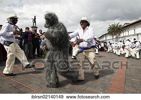 Male dance group on the edge of a procession during a car-free Sunday in the historic town centre of Quito, Ecuador, South America View Large Photo Image Stock Photo - Male dance group on the edge of a procession during a car-free Sunday in the historic town centre of Quito, Ecuador, South America. Fotosearch