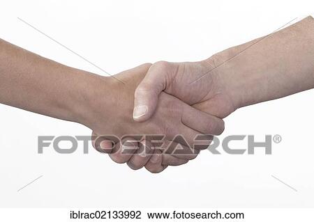 Stock Image - Man and woman shaking hands. Fotosearch