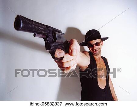 Man, hat, pistol, temple, head, Berlin, Germany, Europe View Large Photo Image Stock Photo - Man, hat, pistol, temple, head, Berlin, Germany, Europe. Fotosearch