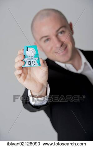 Man presenting Austrian road tax vignette 2012 View Large Photo Image Stock Image - Man presenting Austrian road tax vignette 2012. Fotosearch