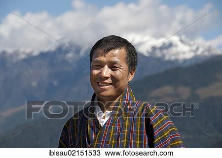 Man smiling, portrait, wearing traditional Gho dress, plaid fabric, the Himalayas, Bhutan, South Asia, Asia View Large Photo Image Stock Image - Man smiling, portrait, wearing traditional Gho dress, plaid fabric, the Himalayas, Bhutan, South Asia, Asia. Fotosearch