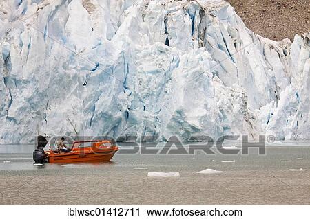Man with a red boat in front of the Karale glacier, Sermiligaaq Fjord, East Greenland, Greenland, Denmark, North America View Large Photo Image Stock Image - Man with a red boat in front of the Karale glacier, Sermiligaaq Fjord, East Greenland, Greenland, Denmark, North America. Fotosearch