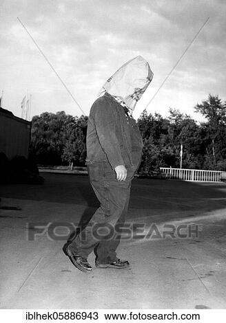 Stock Image - Man with bag over his head, 2015, Germany, Europe. Fotosearch