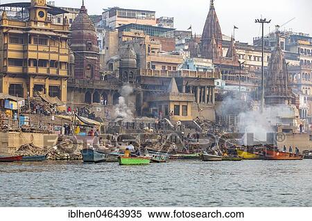 Stock Photography - Manikarnika Ghat, main cremation ground at the ghats of Ganges river, Varanasi, Uttar Pradesh, India, Asia. Fotosearch