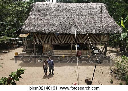 Married couple, Danilo and Carlota of the Quechua folk standing in front of their house in a village with no road access in the rainforest of the Oriente, Curaray, Ecuador, South America View Large Photo Image Stock Image - Married couple, Danilo and Carlota of the Quechua folk standing in front of their house in a village with no road access in the rainforest of the Oriente, Curaray, Ecuador, South America. Fotosearch