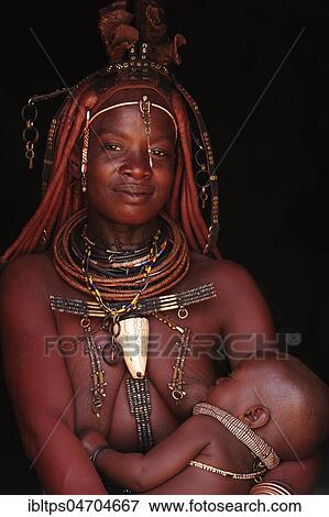 Married Himba woman breastfeeding her baby, Kunene District, Kaokoveld, Namibia, Africa View Large Photo Image Stock Photo - Married Himba woman breastfeeding her baby, Kunene District, Kaokoveld, Namibia, Africa. Fotosearch