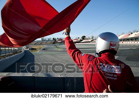 Stock Image - Marshall at the Circuit de Catalunya waving a red flag, Formula 1 testing sessions, February 2012, Barcelona, Spain, Europe. Fotosearch