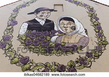 Stock Photo - Medieval peasant couple in a wreath of flowers, mural by Italian street artist Pixel Pancho, The Crystal Ship Festival 2016, Ostend, West-Flanders, Belgium, Europe. Fotosearch