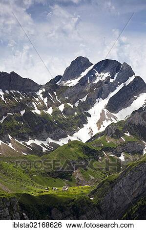 Stock Photograph - Meglisalp mountain pasture with Mt Altmann in the Alpstein massif, Appenzell, Switzerland, Europe. Fotosearch